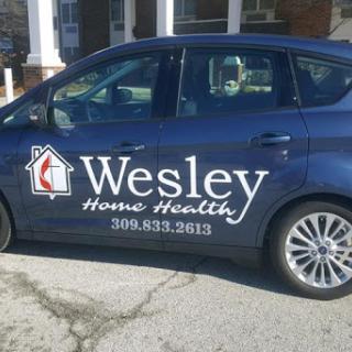 A vehicle featuring the branding of Wesley Home Health, indicating its role in healthcare services.