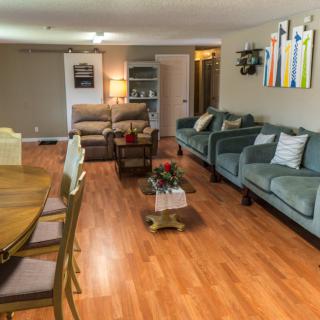 Spacious living room with comfortable seating and modern decor.
