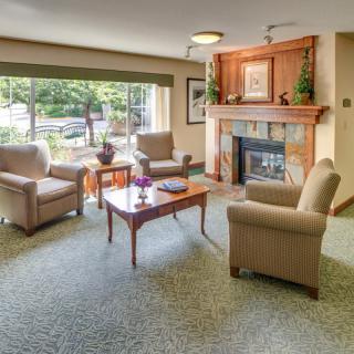 Cozy living room with a fireplace and comfortable seating area.