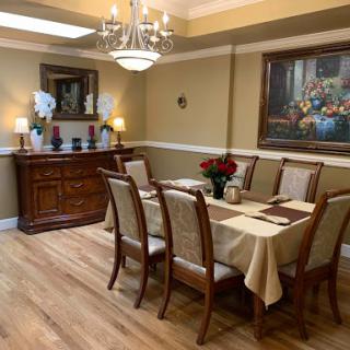 A beautifully arranged dining room featuring elegant furniture and tasteful decor.