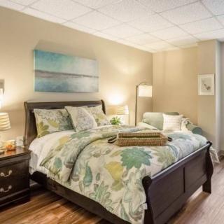 A cozy bedroom with elegant decor and a comfortable bed.