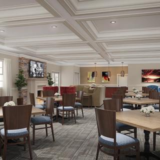 A cozy dining area with neatly arranged tables and chairs, featuring warm lighting and elegant decor.