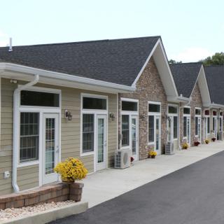 A row of modern residential buildings with a clean architectural design.