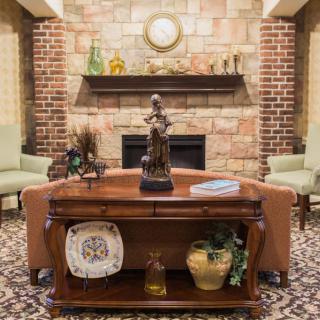 Cozy living room with a brick fireplace and elegant decor.