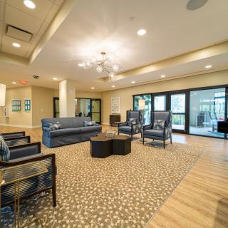 A modern lounge area with comfortable seating and elegant lighting.