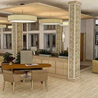 A modern reception area with stylish furniture and lighting.