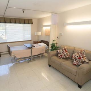 A cozy hospital room designed for comfort and care.