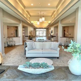 A spacious and elegantly designed modern living room with stylish furnishings and decor.