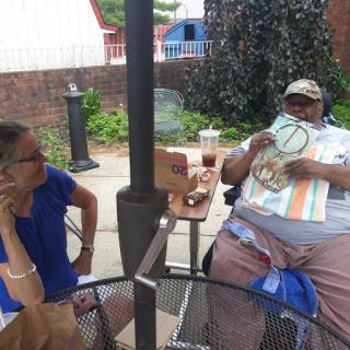 Enjoying a sunny day at the caf with good company.