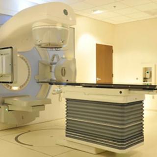 A radiation therapy machine used in a hospital setting for cancer treatment.