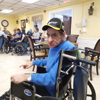 A person in a wheelchair enjoying their time at a community center.
