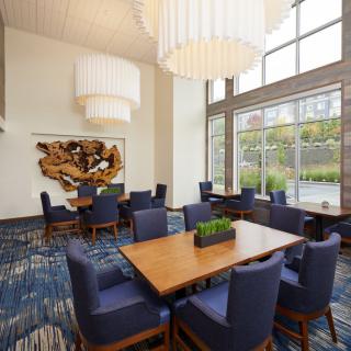 A modern dining area with large windows and elegant lighting.