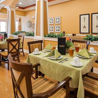 Elegant dining area with neatly arranged tables and classic decor.