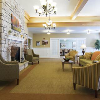 A cozy living room with elegant furniture and a fireplace.