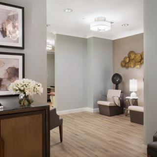 A modern waiting room with stylish decor and comfortable seating.