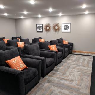 A cozy home theater with comfortable seating and modern decor.