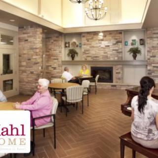 Residents enjoying the communal dining area in a senior living facility.