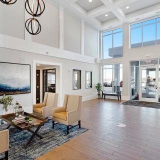 A modern and spacious lobby with stylish furnishings and contemporary lighting.
