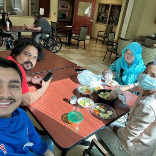 A fun gathering with friends enjoying a meal together.