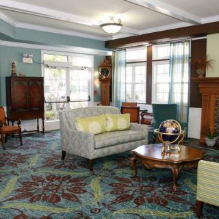 A cozy living room with elegant furniture and ample natural light.