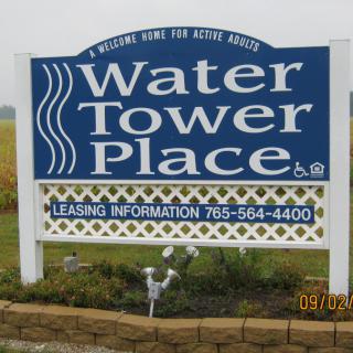 A sign for Water Tower Place with leasing contact information.