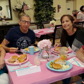 A group of people enjoying a meal together at a restaurant.