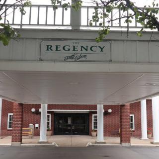 Entrance of the Regency Hotel with a prominent sign above.