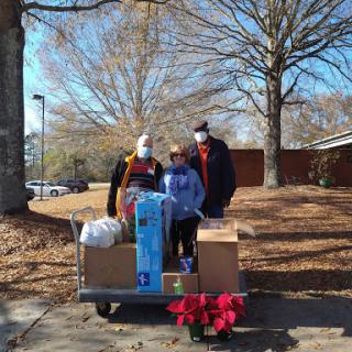 Community members working together to deliver holiday cheer.