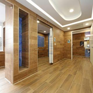A modern interior featuring warm wooden tones and spacious design elements.