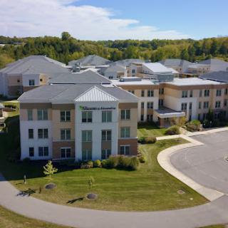 Aerial view of modern residential buildings surrounded by greenery.