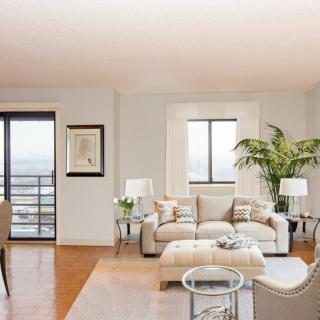 A modern living room with comfortable furniture and abundant natural light.
