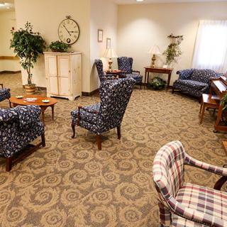 A cozy living room with assorted seating and decor.