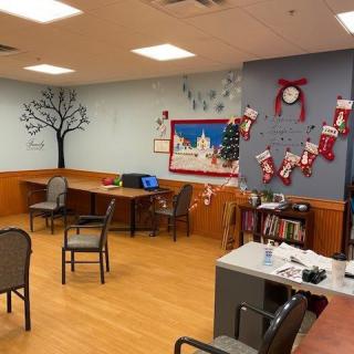 A festive office space decorated for the holidays with Christmas stockings and ornaments.