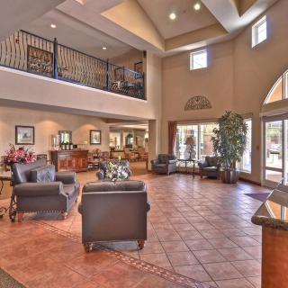 A spacious and well-lit lobby with comfortable seating and elegant interior design.