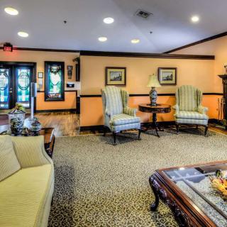 A cozy living room with comfortable seating and elegant decor.