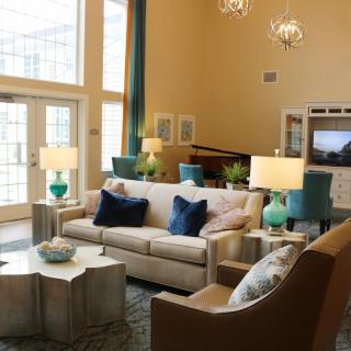 A modern living room with elegant furniture and natural light.