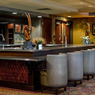 A stylish bar area featuring modern seating and elegant decor.