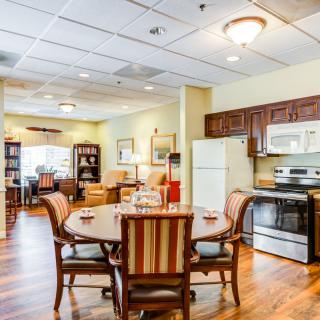 A cozy kitchen and dining area with modern appliances and comfortable seating.