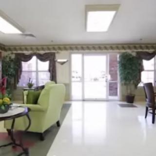 A bright and spacious lobby with comfortable seating and large windows.
