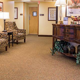 An inviting lobby area with comfortable chairs and a decorative table.