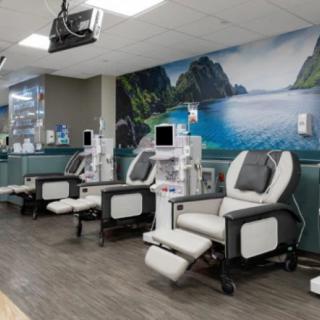 A clean and modern dialysis center with comfortable treatment chairs and medical equipment.