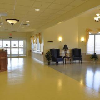 A spacious and welcoming lobby area featuring comfortable seating and bright lighting.