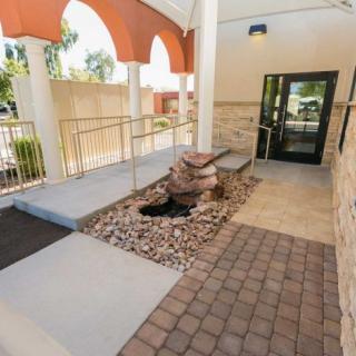 An entrance with a ramp and doorway, featuring modern architectural design.
