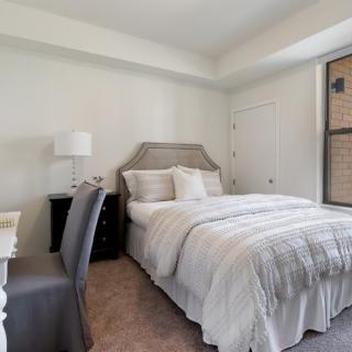 A cozy and well-decorated bedroom with a comfortable bed and stylish furnishings.