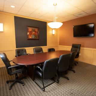 A well-furnished conference room suitable for meetings and discussions.