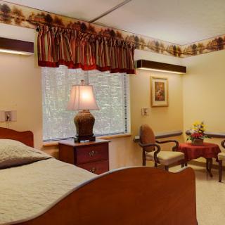 A cozy bedroom featuring warm decor and comfortable furnishings.