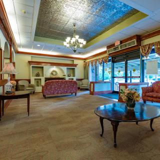 A cozy lobby area featuring elegant furnishings and natural light.