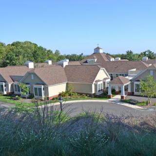 A modern residential community basking in bright sunlight.