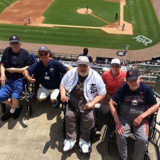 A group of people enjoying a baseball game at the stadium.