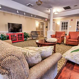 A cozy living room with comfortable seating and a television.